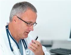 Physician dictating with an iPhone Physician dictating with an iPhone