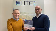 Mark Eost (M-Files), left, and Daren Parsons (Elite) celebrating Elite joining M-Files Partner Program