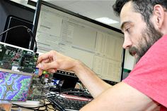 In the image, a demonstration board containing an Arm CPU generates a fractal pattern on the screen, while the engineer views the operation of the program via the GUI on his workstation In the image, a demonstration board containing an Arm CPU generates a fractal pattern on the screen, while the engineer views the operation of the program via the GUI on his workstation