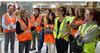 Cummins President and CEO Jennifer Rumsey joins high school students in touring one of the company’s engine plants as part of celebrations of International Day of the Girl