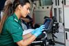 A paramedic uses a docked TOUGHBOOK G2 in her ambulance